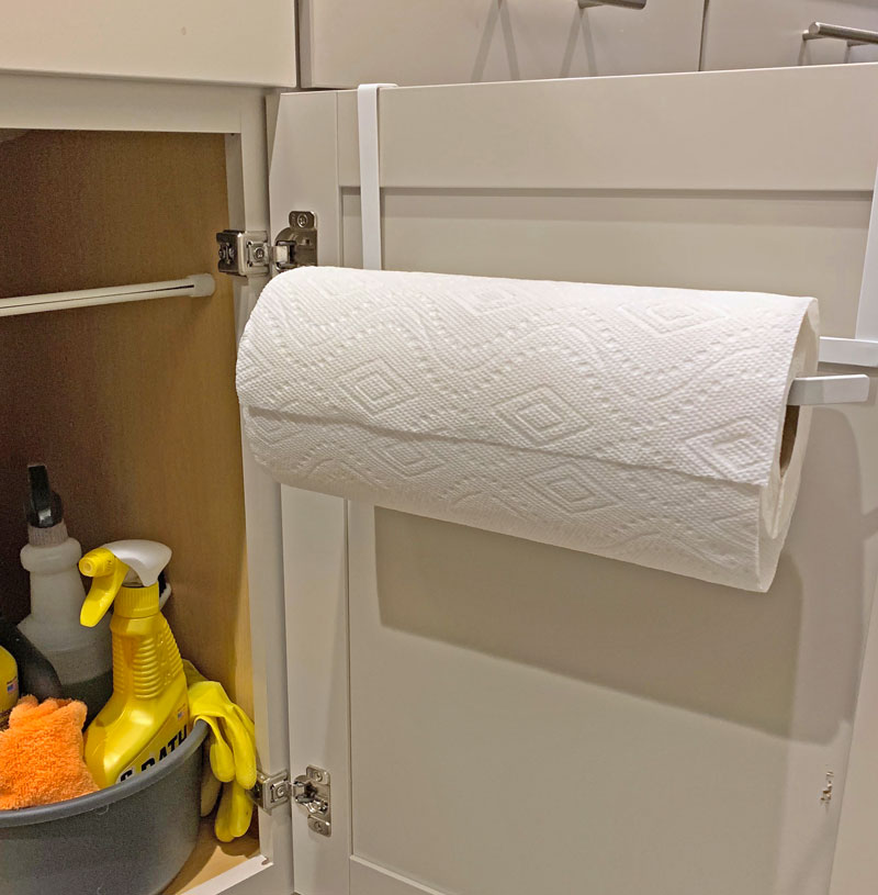 Paper towel hanging from cabinet door attachments